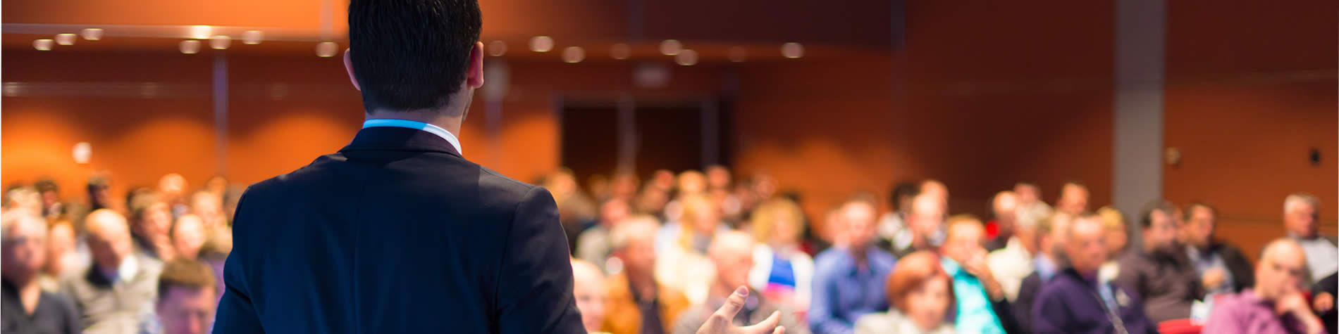 Man presenting to audience.