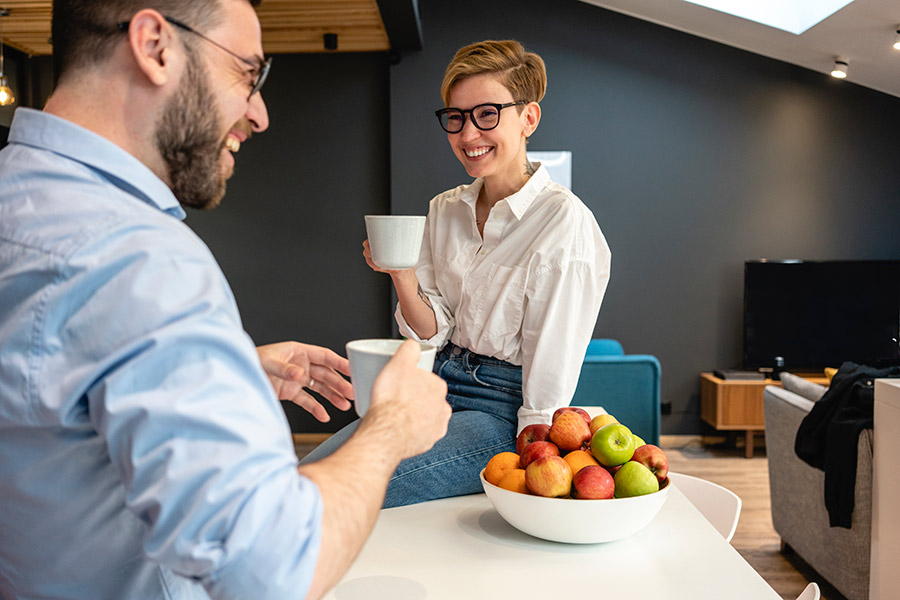 man and woman talking over coffee