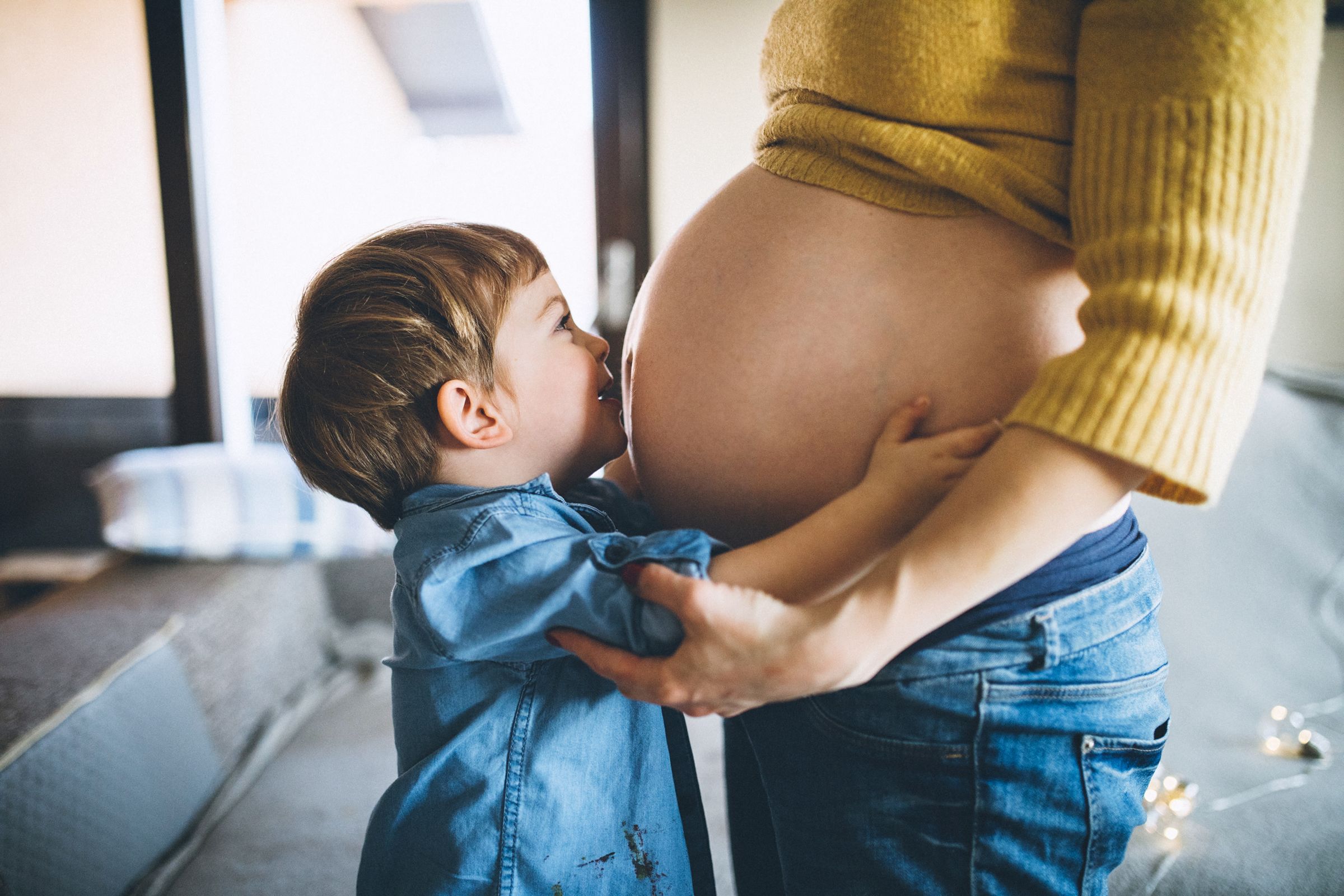 Pregnant mother with her son